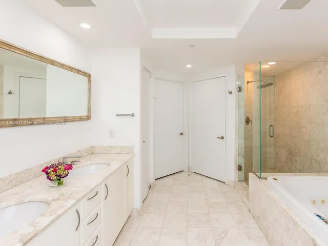 a bathroom with a bathtub and a shower