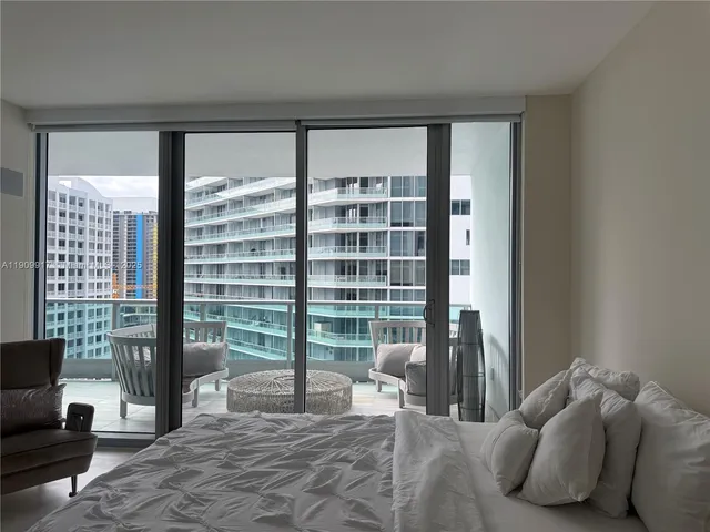 a bedroom with a bed and a mirror