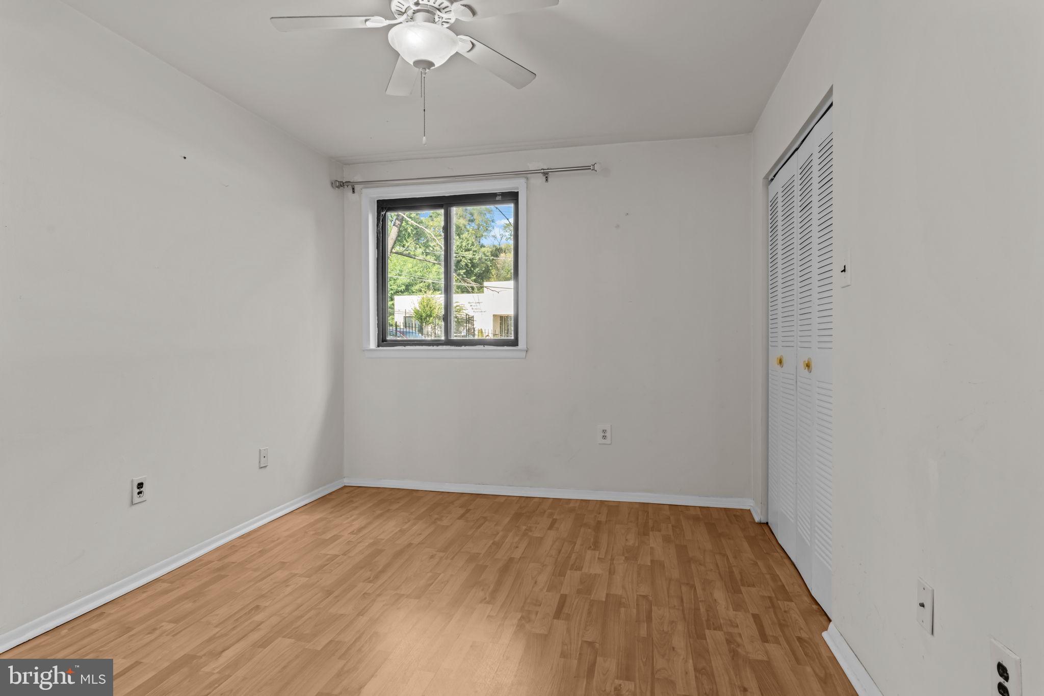 3750 Clarendon Avenue, Unit 3 Philadelphia, PA 19114 - Photo 13 of 20 wooden floor in an empty room with a window