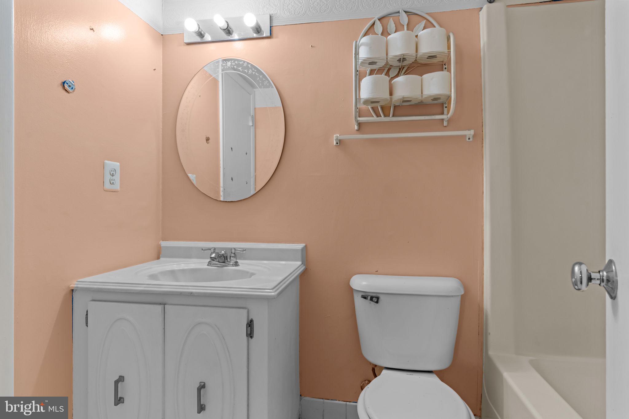 3750 Clarendon Avenue, Unit 3 Philadelphia, PA 19114 - Photo 14 of 20 a bathroom with a toilet sink and mirror