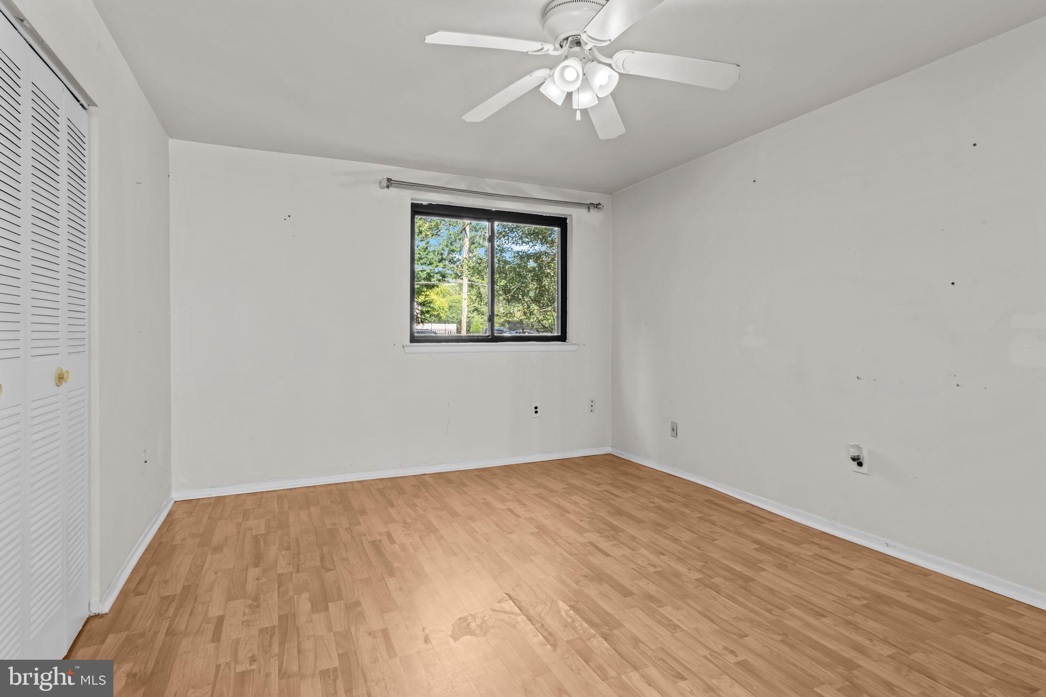 3750 Clarendon Avenue, Unit 3 Philadelphia, PA 19114 - Photo 16 of 20 wooden floor in an empty room with a window