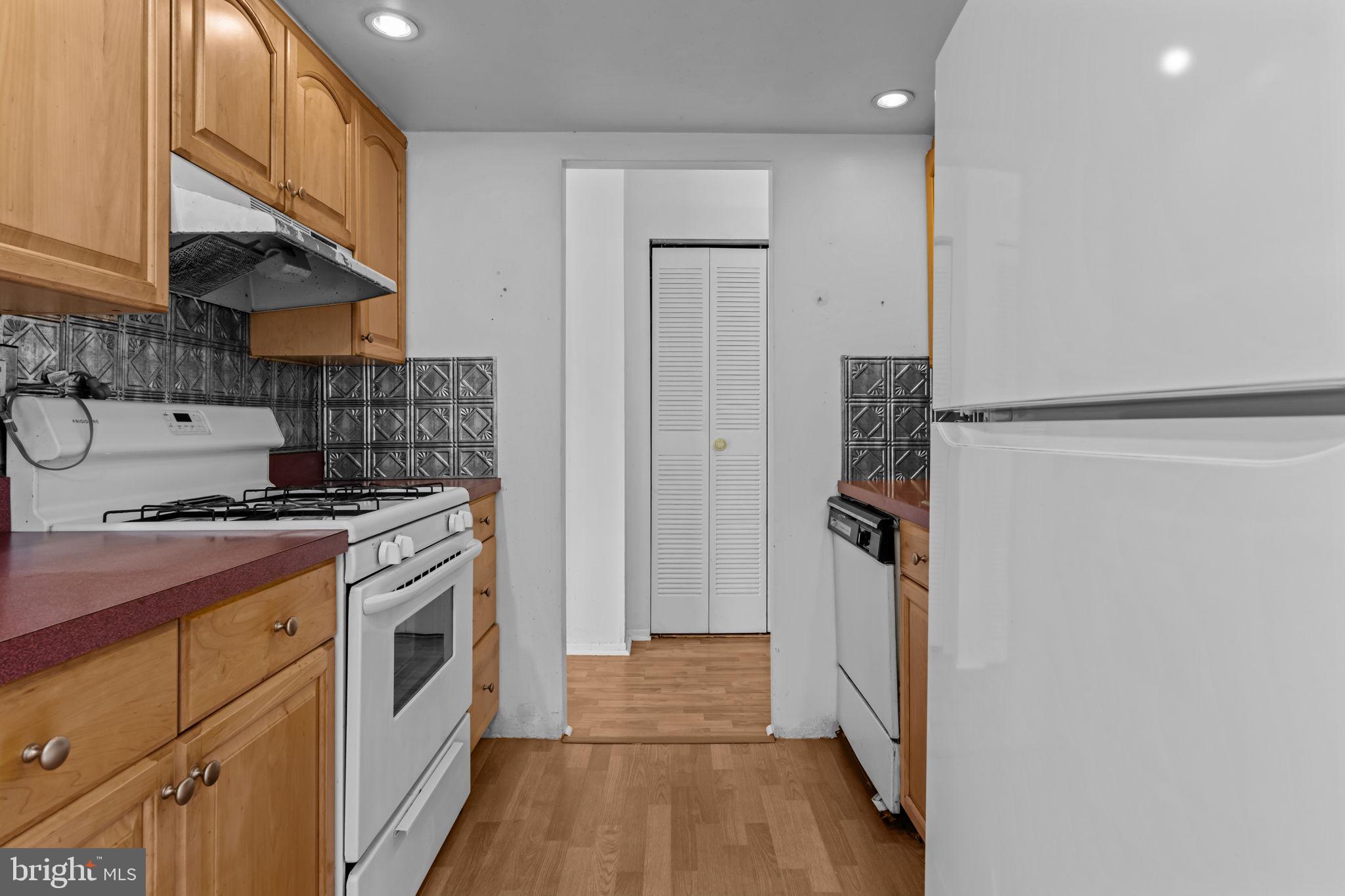 3750 Clarendon Avenue, Unit 3 Philadelphia, PA 19114 - Photo 9 of 20 a kitchen with a stove a refrigerator and a stove