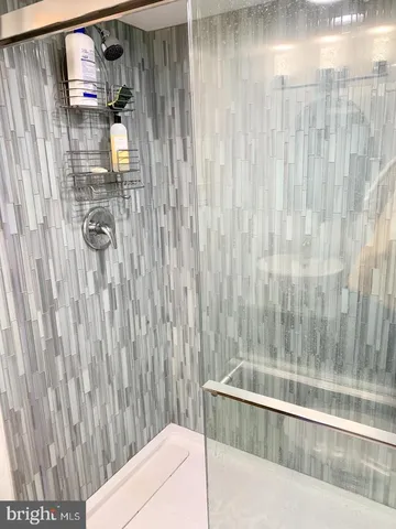 a bathroom with a bathtub and shower