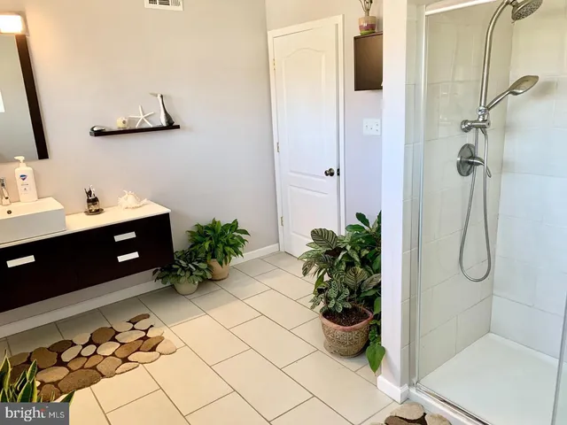 a bathroom with a shower curtain and a sink