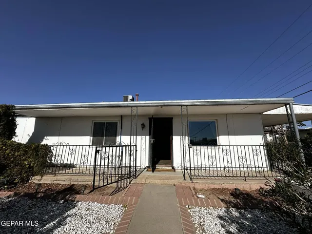 a front view of a house with a porch