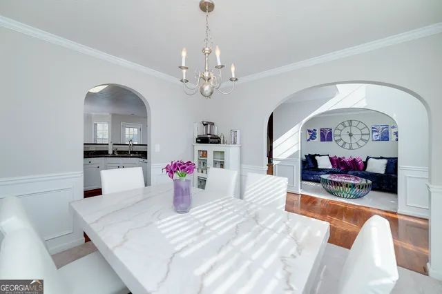 a bedroom with furniture and a chandelier