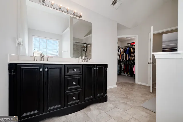 a kitchen with a sink and a refrigerator