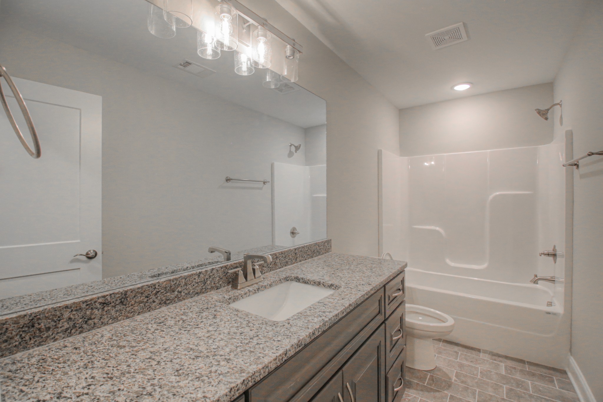 2575 Tracy Road Watertown, TN 37184 - Photo 18 of 23 a bathroom with a granite countertop sink and a mirror