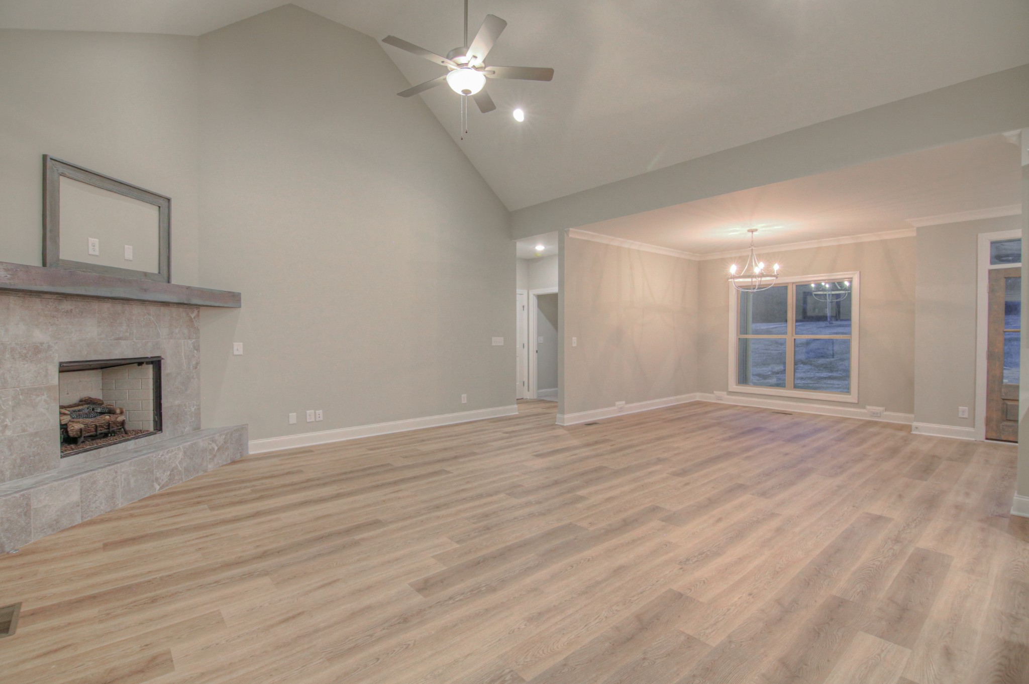 2575 Tracy Road Watertown, TN 37184 - Photo 5 of 23 a view of an empty room with wooden floor fireplace and a window