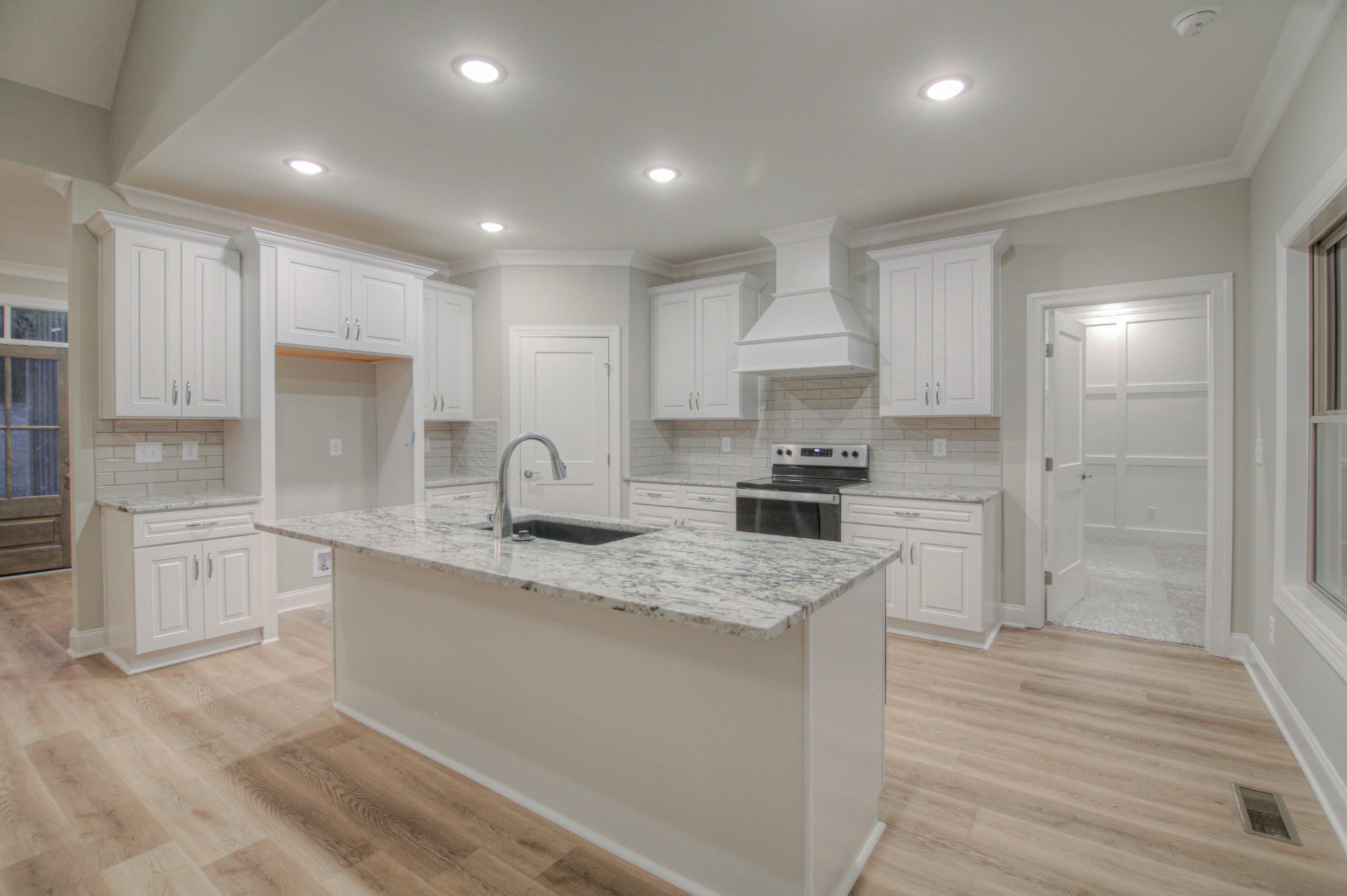 2575 Tracy Road Watertown, TN 37184 - Photo 6 of 23 a kitchen with white cabinets appliances and sink