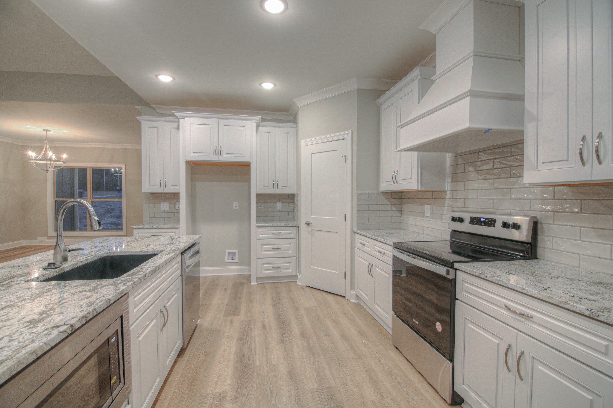 2575 Tracy Road Watertown, TN 37184 - Photo 7 of 23 a kitchen with stainless steel appliances granite countertop a sink stove and refrigerator