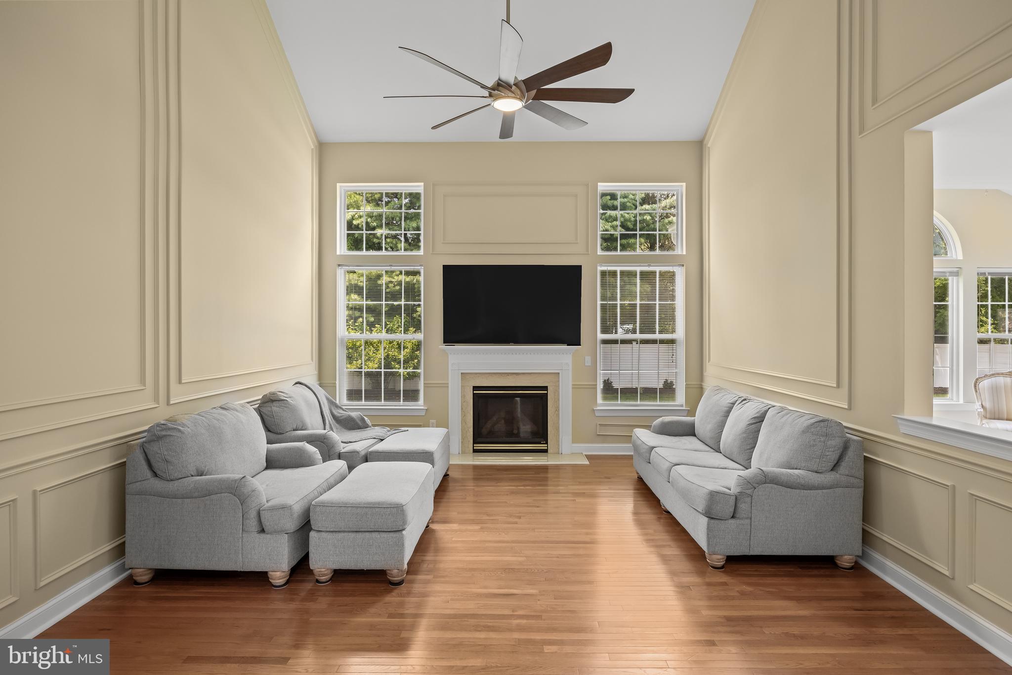 54 Jasmine Road Lumberton, NJ 08048 - Photo 21 of 60 a living room with furniture a fireplace and a flat screen tv