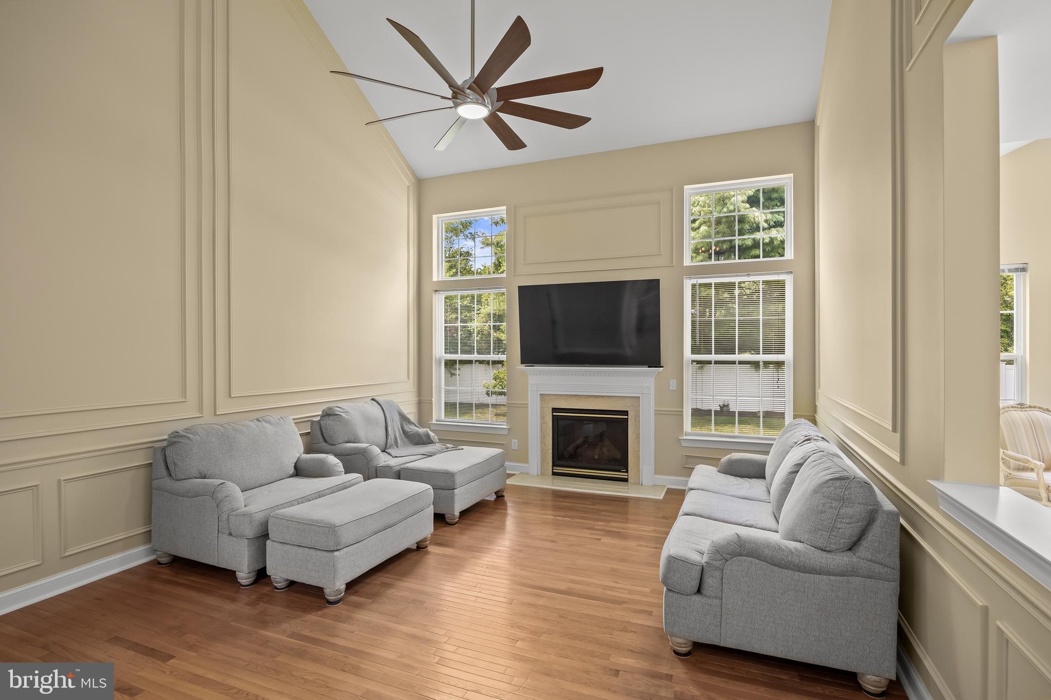 54 Jasmine Road Lumberton, NJ 08048 - Photo 22 of 60 a living room with furniture a flat screen tv and a fireplace