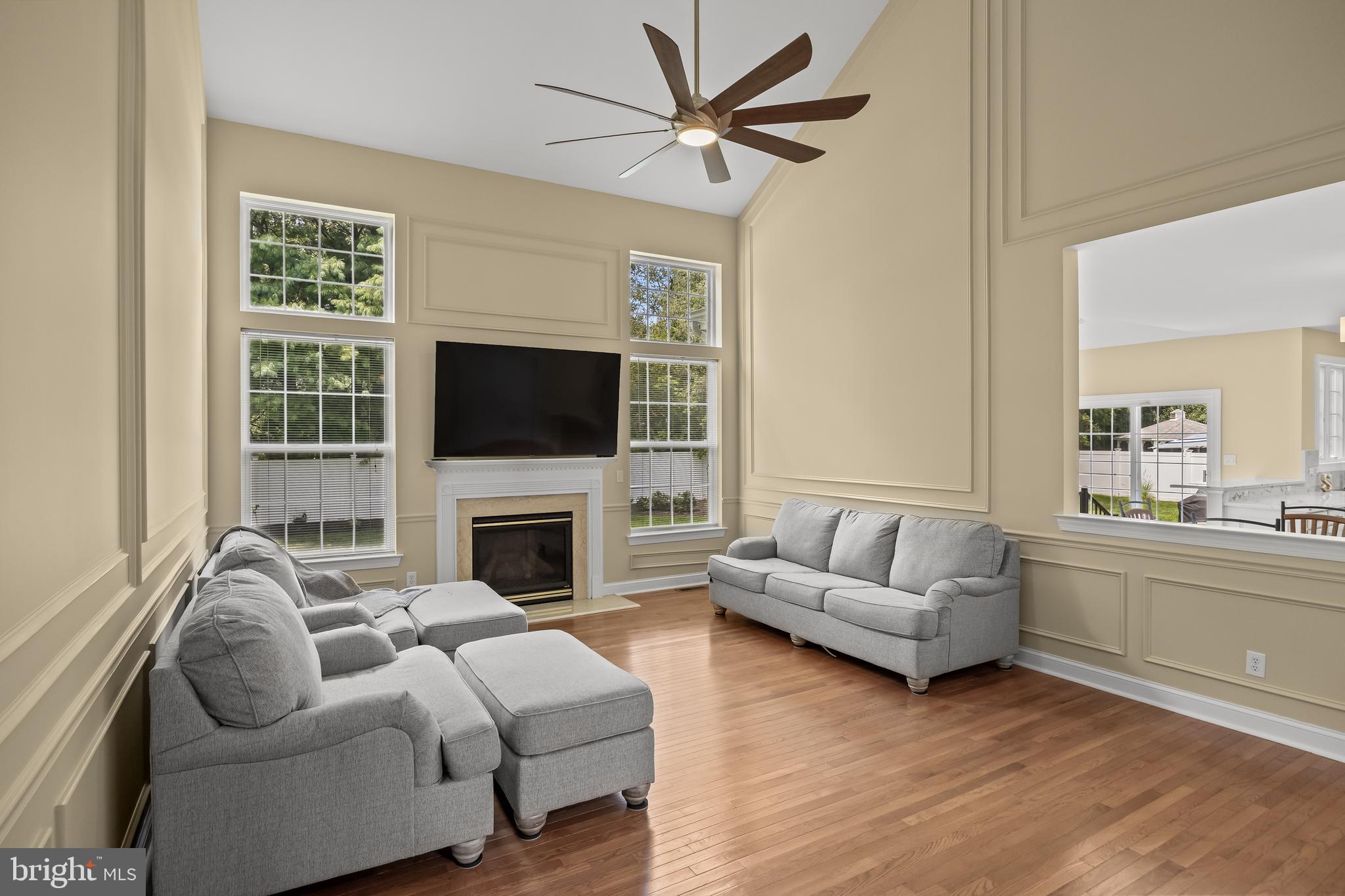54 Jasmine Road Lumberton, NJ 08048 - Photo 23 of 60 a living room with furniture a fireplace and a flat screen tv