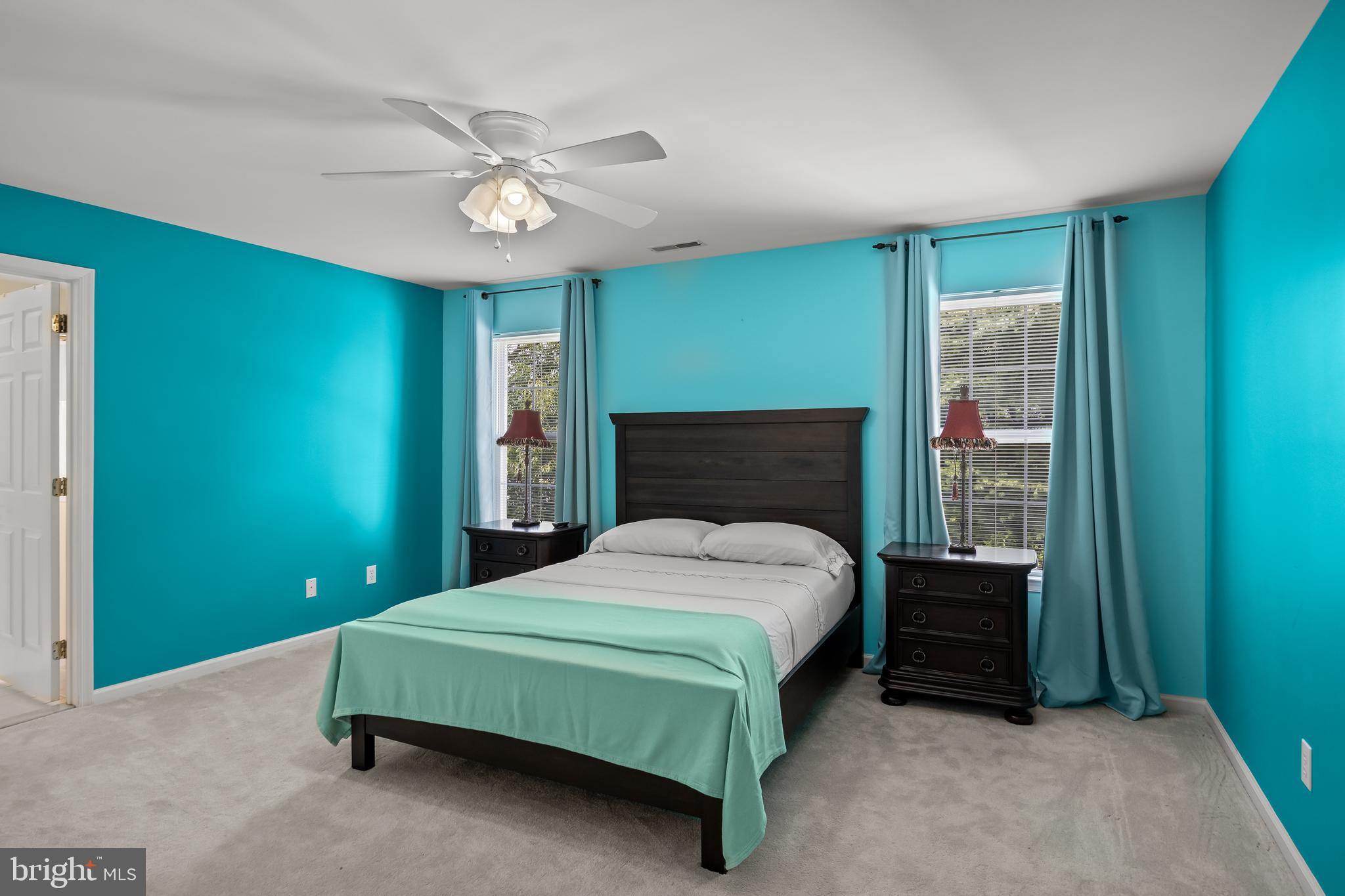 54 Jasmine Road Lumberton, NJ 08048 - Photo 40 of 60 a bedroom with a bed and a chandelier