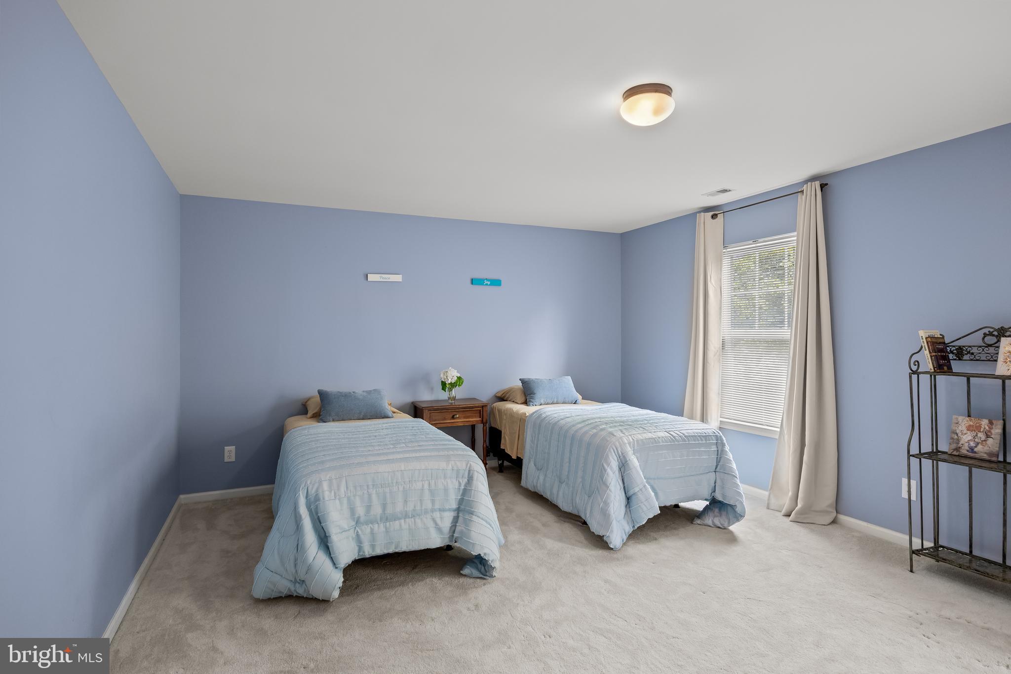 54 Jasmine Road Lumberton, NJ 08048 - Photo 41 of 60 a bedroom with two beds and a book shelf