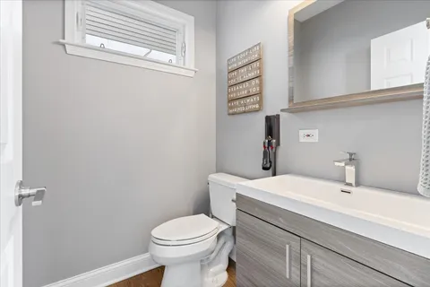 a living room with furniture a flat screen tv and a couch