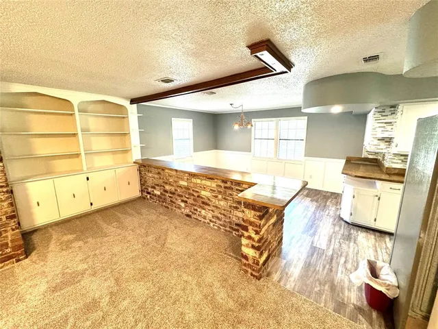 a view of a bathroom with a tub and mirror