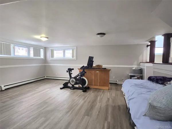 a bedroom with a bed and a couch