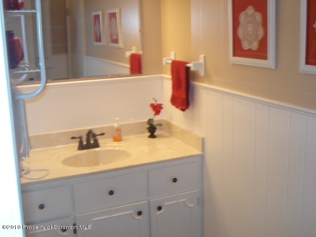 339 Maple Lake Road Moscow, PA 18444 - Photo 16 of 21 a bathroom with a sink and a mirror