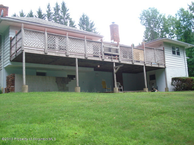 339 Maple Lake Road Moscow, PA 18444 - Photo 2 of 21 a view of a backyard with plants and large trees
