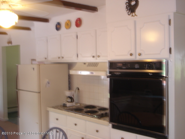 339 Maple Lake Road Moscow, PA 18444 - Photo 6 of 21 a kitchen with a stove and a refrigerator