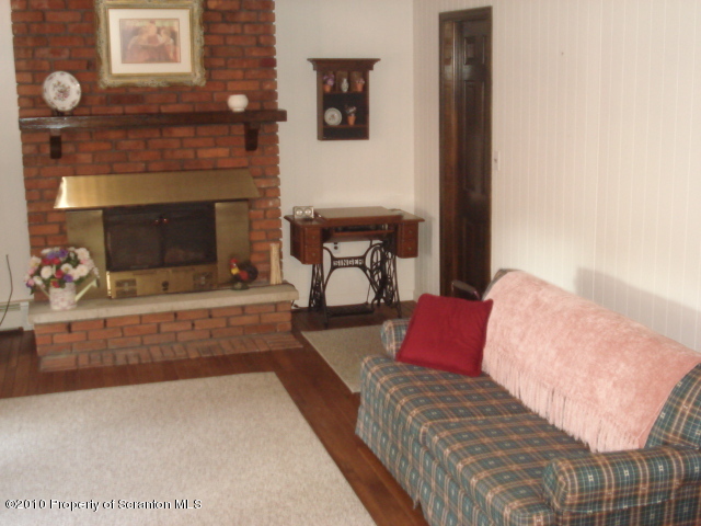 339 Maple Lake Road Moscow, PA 18444 - Photo 8 of 21 a living room with furniture and a fireplace
