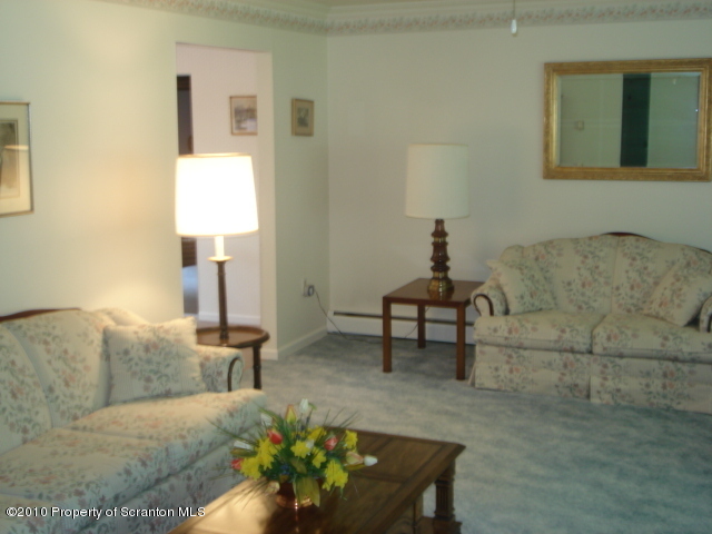 339 Maple Lake Road Moscow, PA 18444 - Photo 10 of 21 a living room with furniture and a lamp