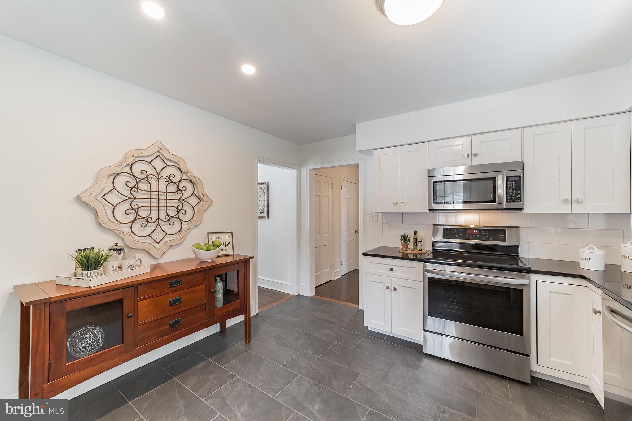 2088 Dutton Mill Road Newtown Square, PA 19073 - Photo 11 of 25 Laminate tile flooring and recessed lighting.