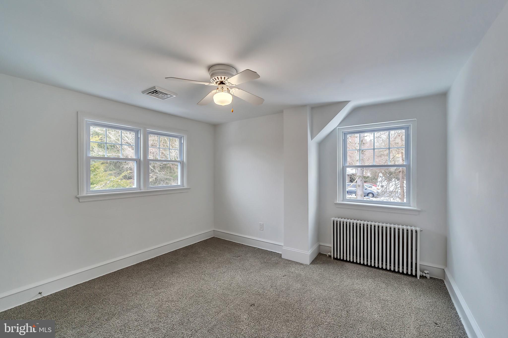 2088 Dutton Mill Road Newtown Square, PA 19073 - Photo 18 of 25 Bedroom 3 with newer carpets and ceiling fan.