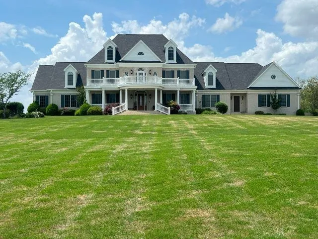 front view of a house with a garden