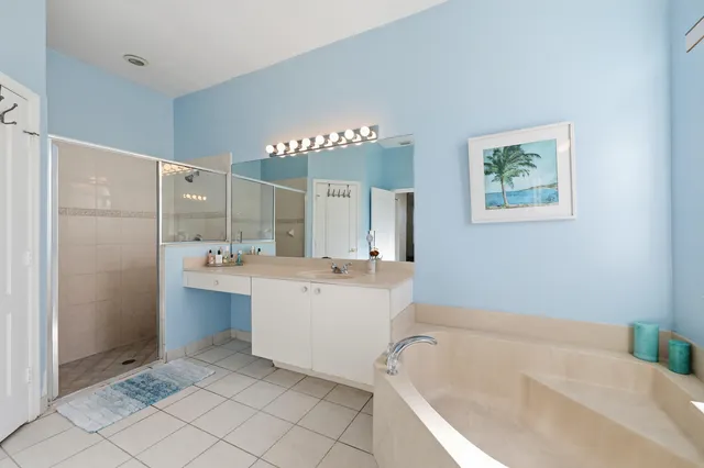 a bathroom with a bathtub and a sink