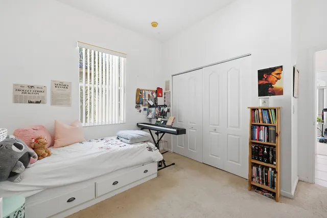 a bedroom with furniture and a window