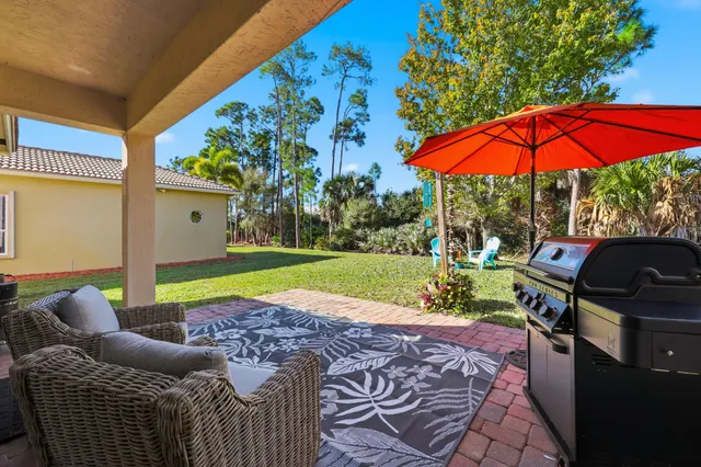 a view of yard with patio