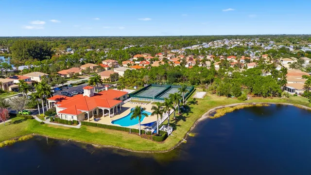 view of a lake with lawn chairs