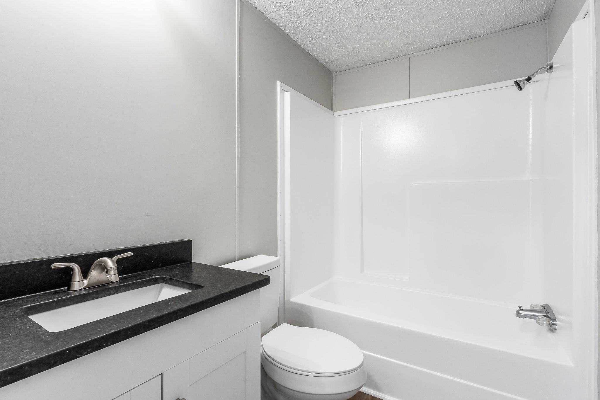 689 Capshaw Road Smithville, TN 37166 - Photo 18 of 29 a bathroom with a granite countertop sink toilet and shower