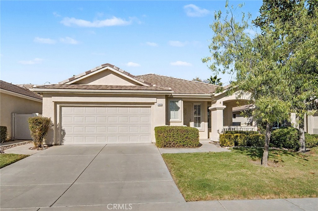 28920 Raintree Drive Menifee, CA 92584 - Photo 13 of 51 a front view of a house with garden