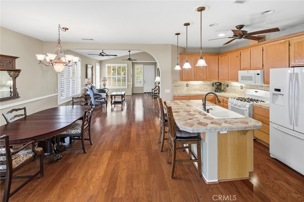 28920 Raintree Drive Menifee, CA 92584 - Photo 17 of 51 a view of a dining room with furniture window and wooden floor