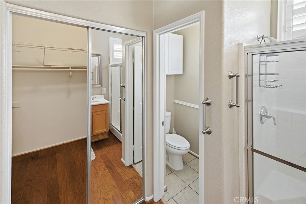 28920 Raintree Drive Menifee, CA 92584 - Photo 36 of 51 a bathroom with a granite countertop sink toilet and shower