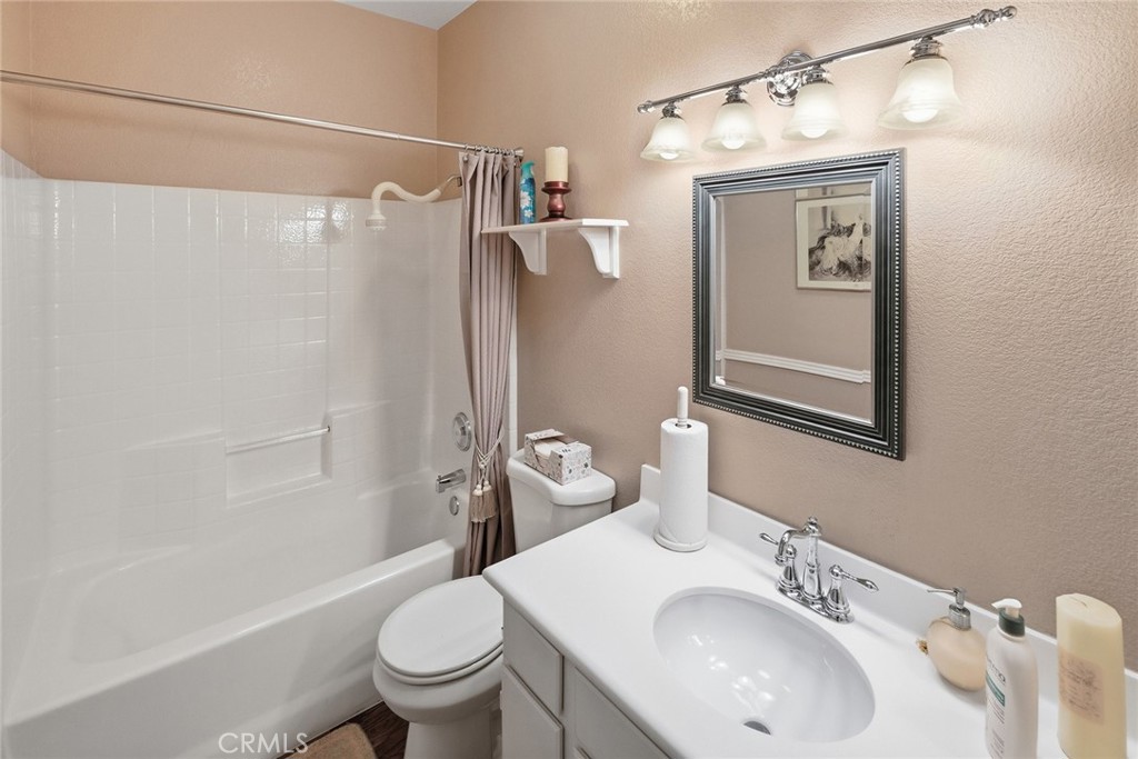 28920 Raintree Drive Menifee, CA 92584 - Photo 40 of 51 a bathroom with a sink toilet and shower