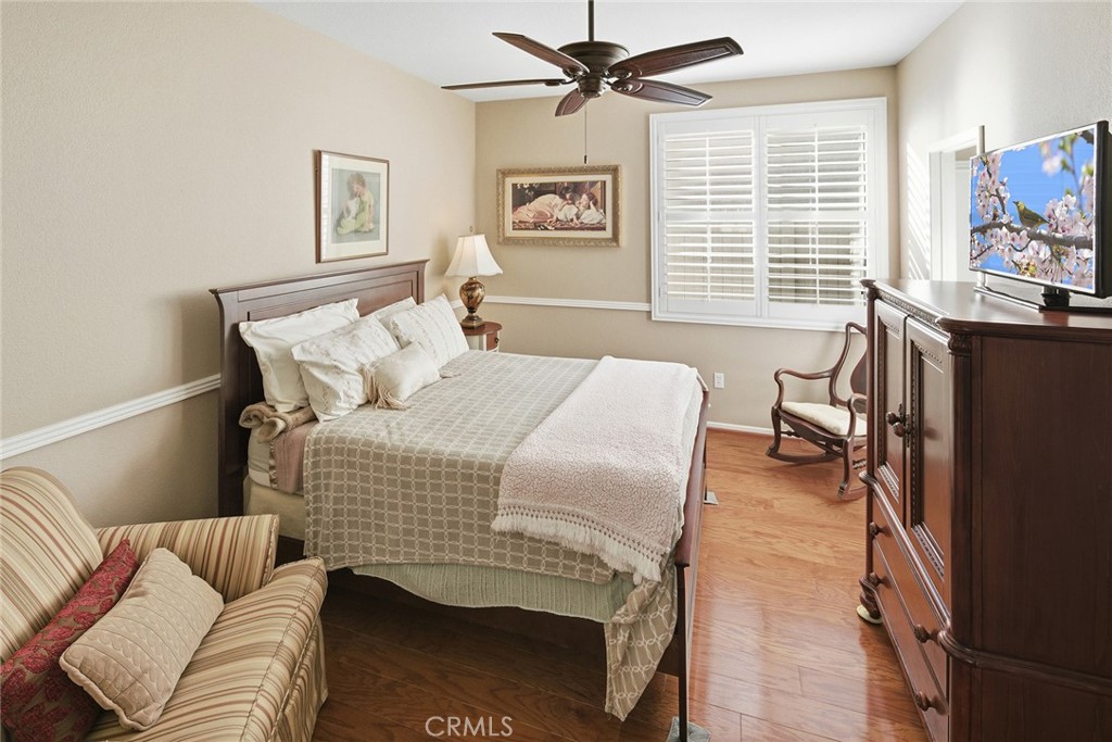 28920 Raintree Drive Menifee, CA 92584 - Photo 41 of 51 a bedroom with a bed and a couch