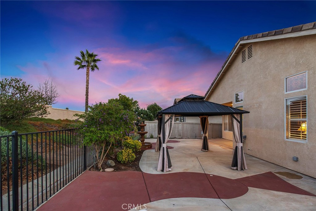 28920 Raintree Drive Menifee, CA 92584 - Photo 5 of 51 a lawn chairs sitting under a umbrella