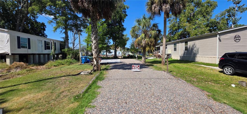 6394 Richard Drive Weeki Wachee, FL 34607 - Photo 1 of 1 a view of a house with a yard