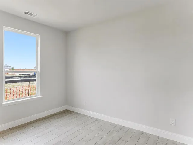 a view of a room that has a window in it