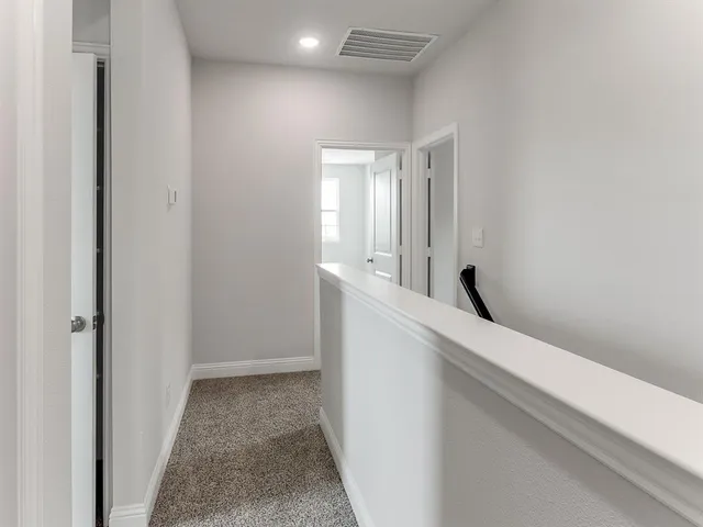 a view of hallway with mirror