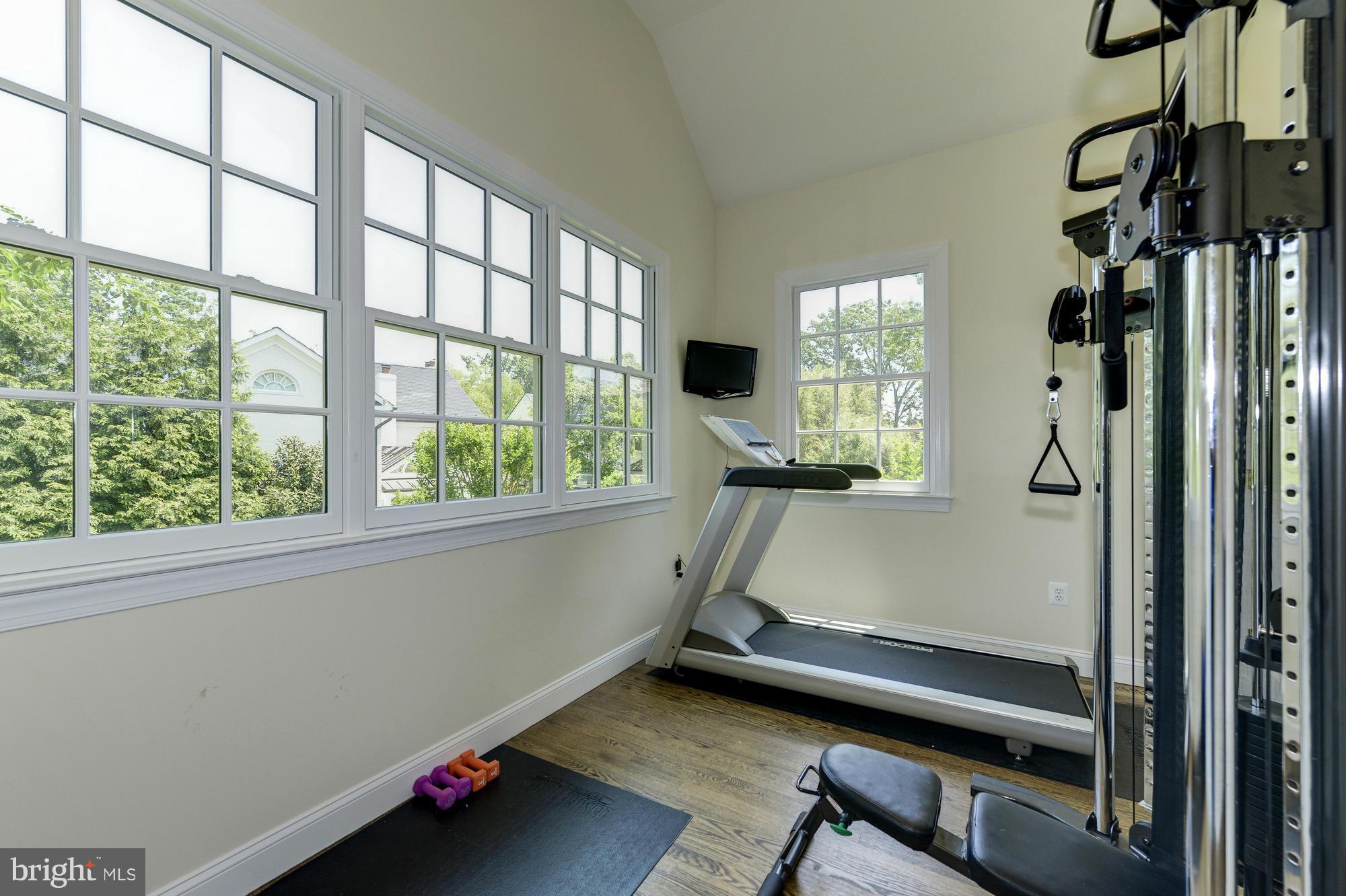 2206 Windsor Road Alexandria, VA 22307 - Photo 21 of 30 a room with gym equipment and a large window
