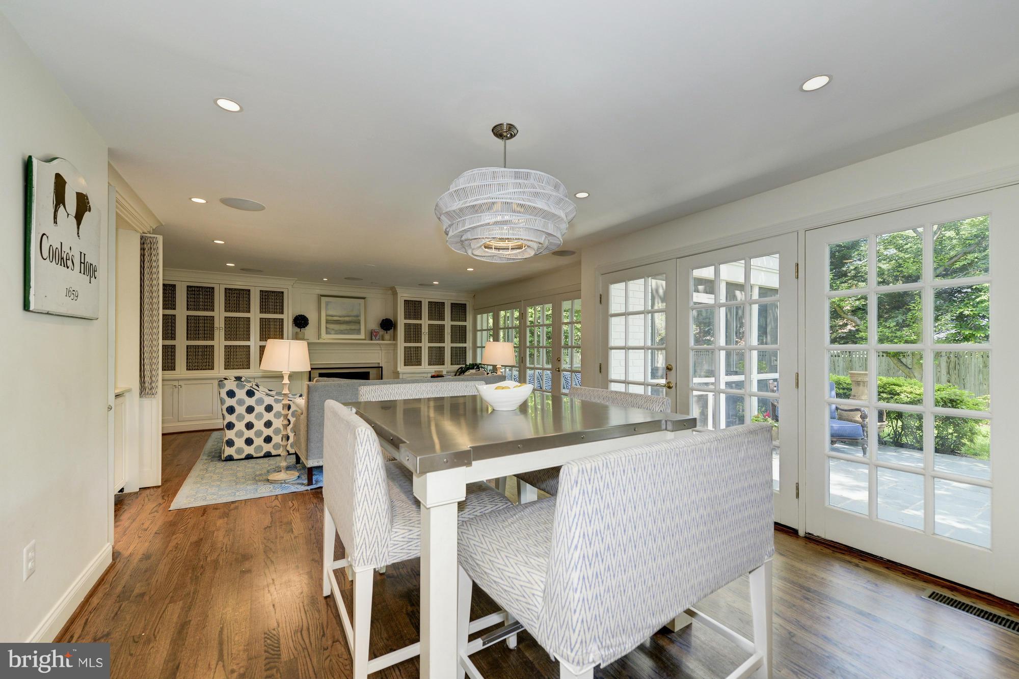 2206 Windsor Road Alexandria, VA 22307 - Photo 8 of 30 a dining room with wooden floor and large windows