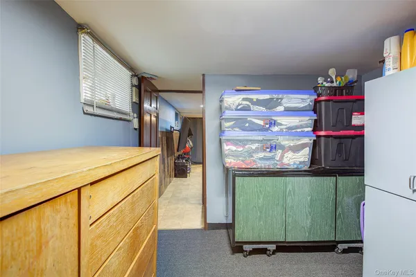 a bedroom with a bed and walk in closet