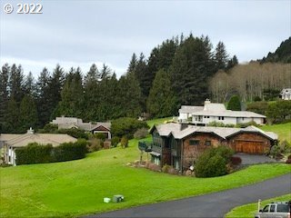 Braeridge Drive, Unit 10 Nehalem, OR 97131 - Photo 14 of 26 a view of yard with swimming pool and green space