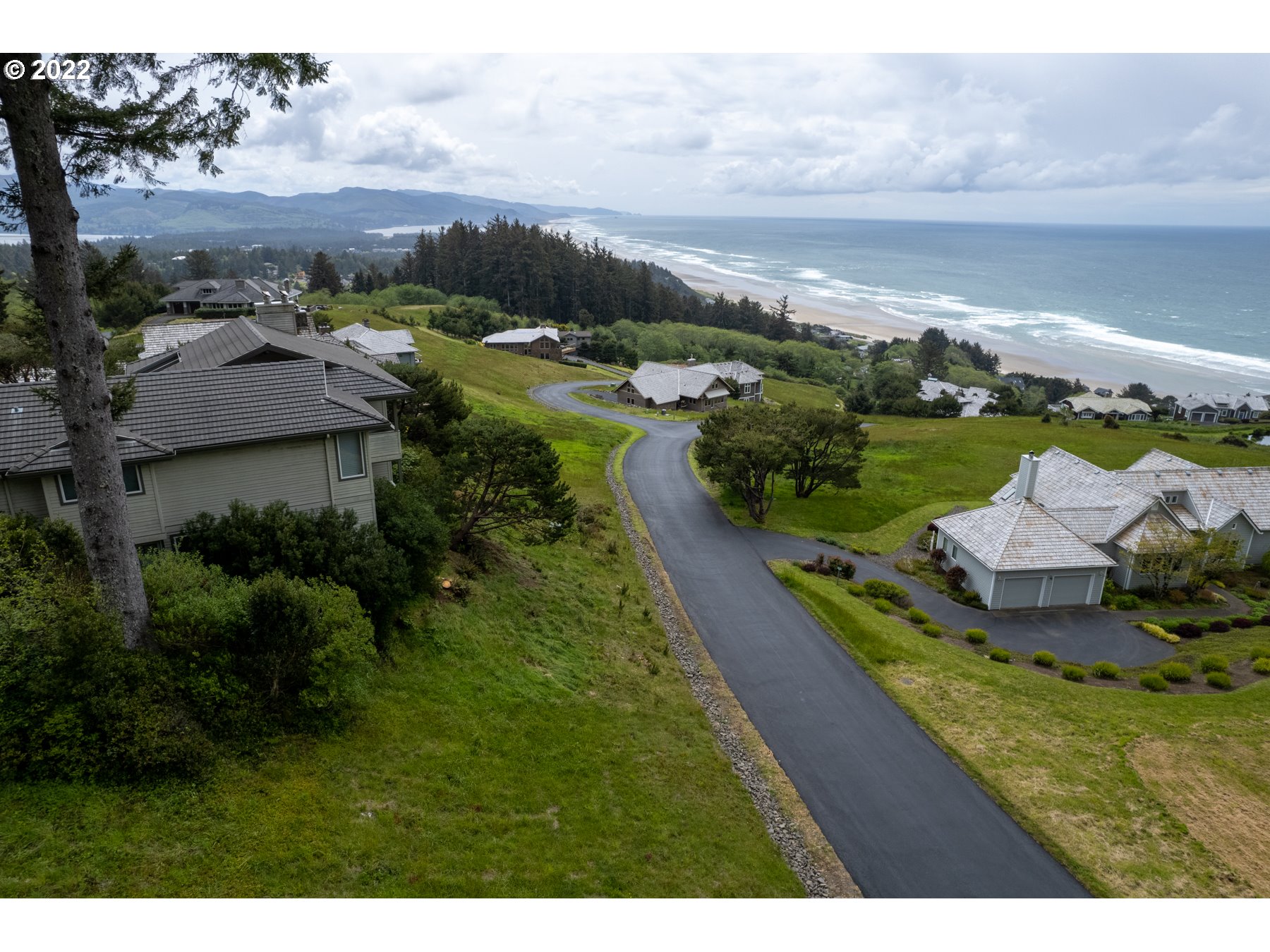 Braeridge Drive, Unit 10 Nehalem, OR 97131 - Photo 17 of 26 a view of a garden with sitting area